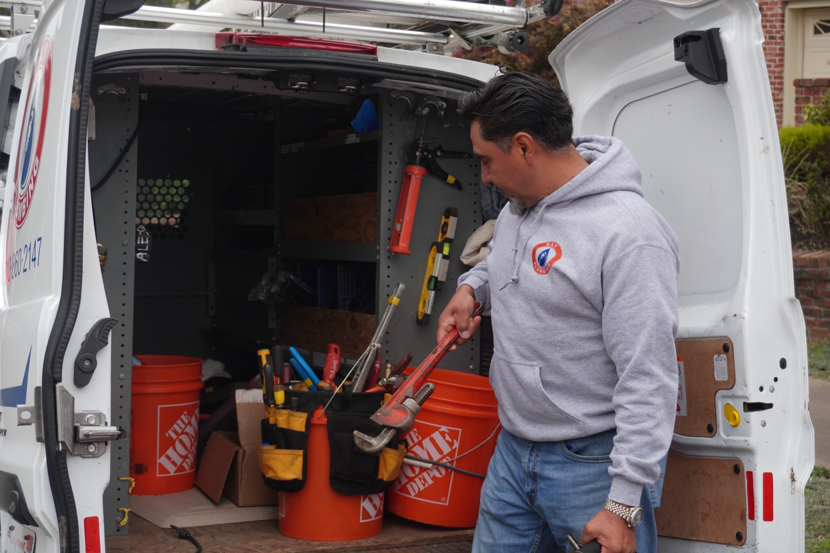 Bay Plumbing owner at the company van