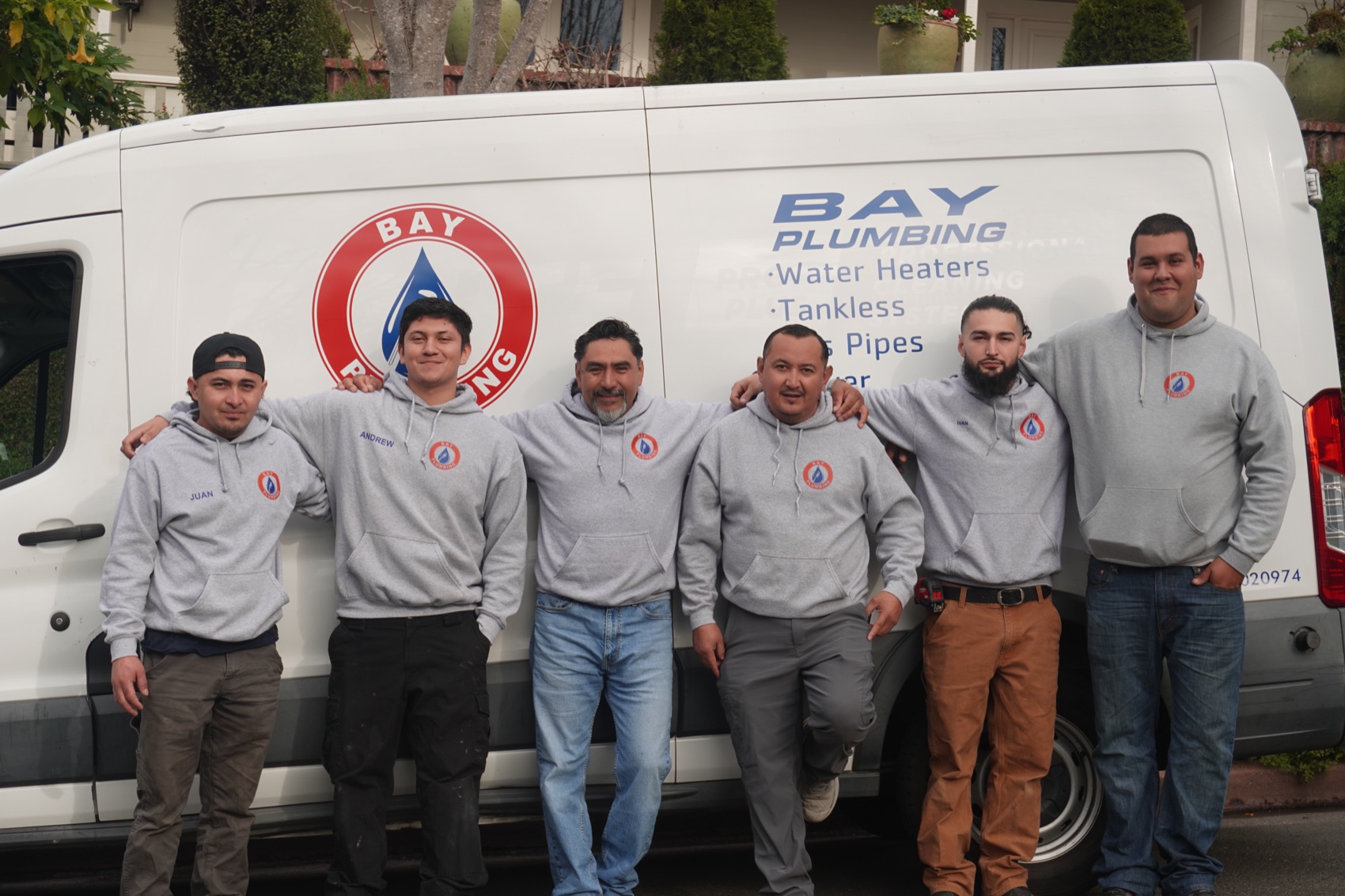 The Bay Plumbing team in front of the company van